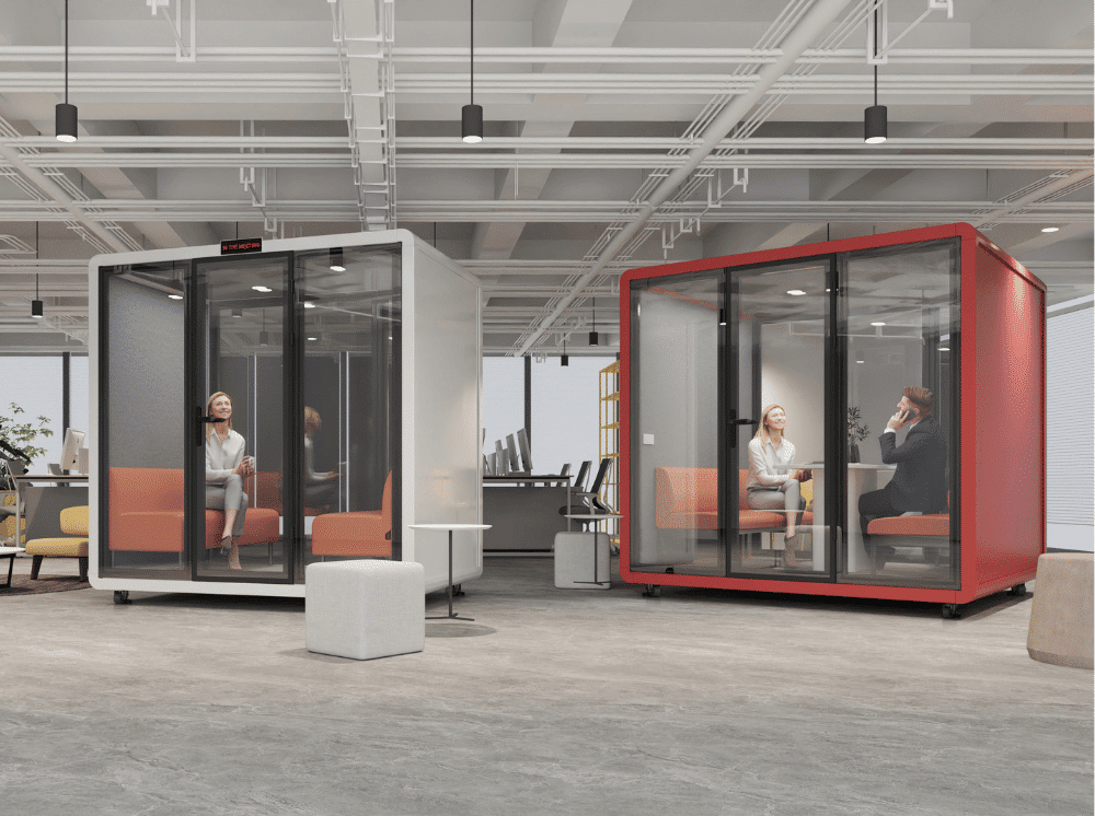 Modern single person office phone booth with wood accents in a bright open plan office