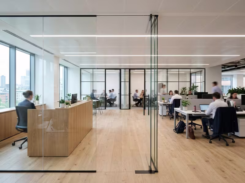 Frameless and framed glass partitions in a modern office Frameless and framed glass partitions in a modern office