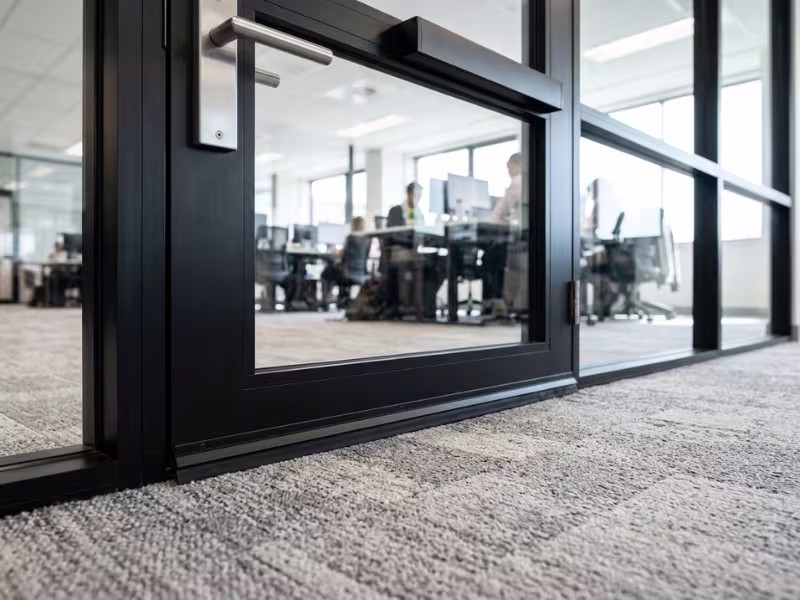 Glass office door with acoustic drop seal Glass office door with acoustic drop seal