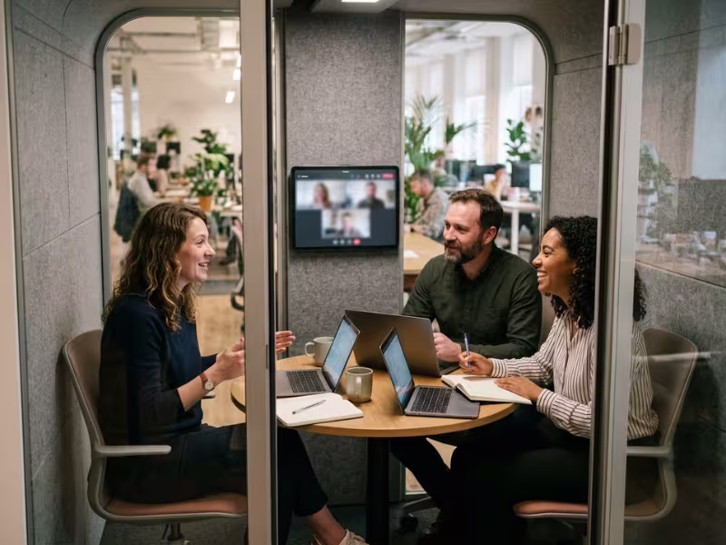 Small team meeting inside 4 person pod Small team meeting inside 4 person pod